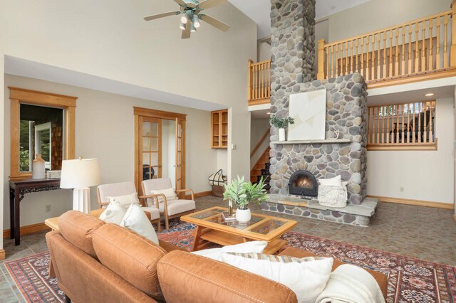 12697 177th St N, May Twp, MN 55047 - living room with baseboards, high vaulted ceiling, a ceiling fan, a fireplace, and healthy amount of natural light