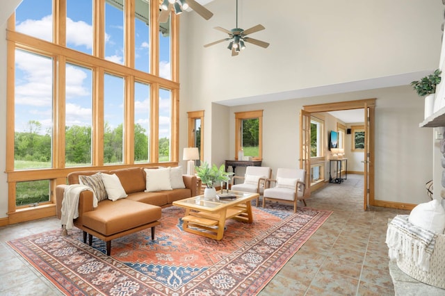 12697 177th St N, May Twp, MN 55047 - living area featuring a towering ceiling, a ceiling fan, and baseboards