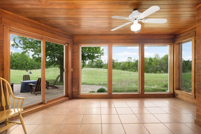 12697 177th St N, May Twp, MN 55047 - unfurnished sunroom with wood ceiling, wooden walls, and tile patterned floors
