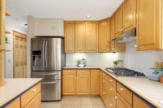 12697 177th St N, May Twp, MN 55047 - kitchen featuring appliances with stainless steel finishes, under cabinet range hood, tasteful backsplash, light countertops, and recessed lighting