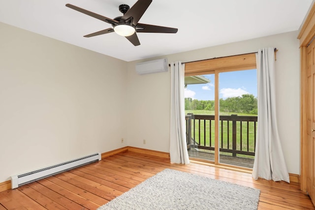 12697 177th St N, May Twp, MN 55047 - empty room with a baseboard radiator, an AC wall unit, light wood-type flooring, ceiling fan, and baseboards