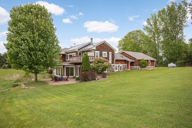 12697 177th St N, May Twp, MN 55047 - rear view of house featuring a lawn, a patio, and stone siding