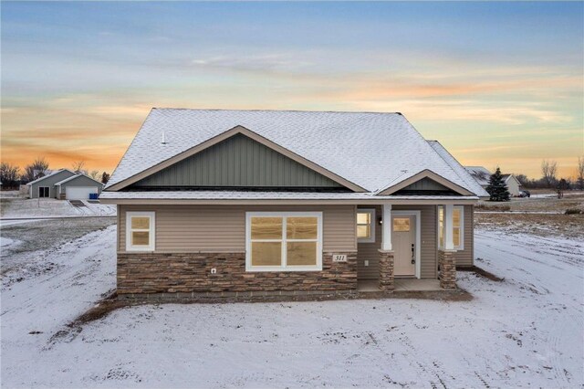 260 Spring St, Osceola, WI 54020 - view of front of house featuring stone siding and board and batten siding
