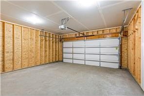 260 Spring St, Osceola, WI 54020 - garage featuring a garage door opener