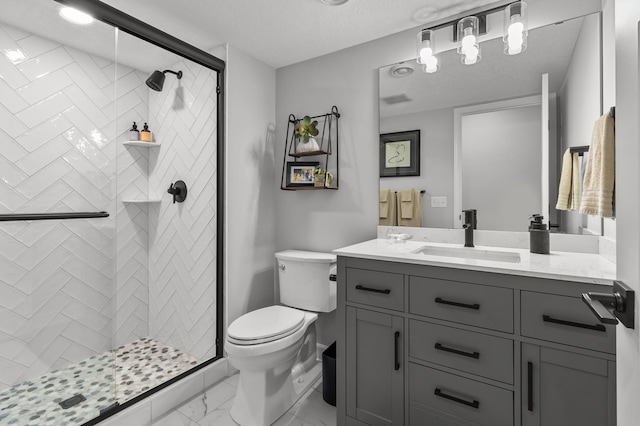 bathroom with marble finish floor, vanity, toilet, and a shower stall