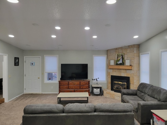 29829 400th Ave, Roseau, MN 56751 - carpeted living area with a stone fireplace, baseboards, and recessed lighting
