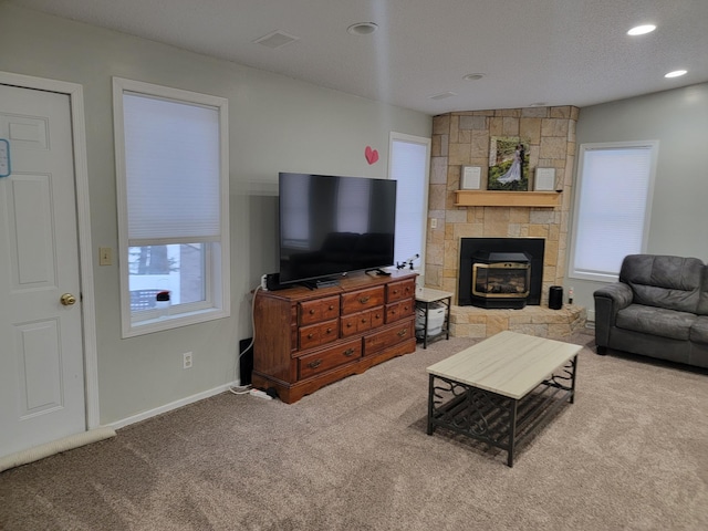 29829 400th Ave, Roseau, MN 56751 - carpeted living area featuring baseboards, recessed lighting, and a fireplace