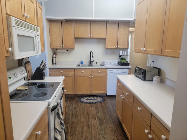 29829 400th Ave, Roseau, MN 56751 - kitchen featuring white appliances, a sink, dark wood-type flooring, light countertops, and brown cabinets