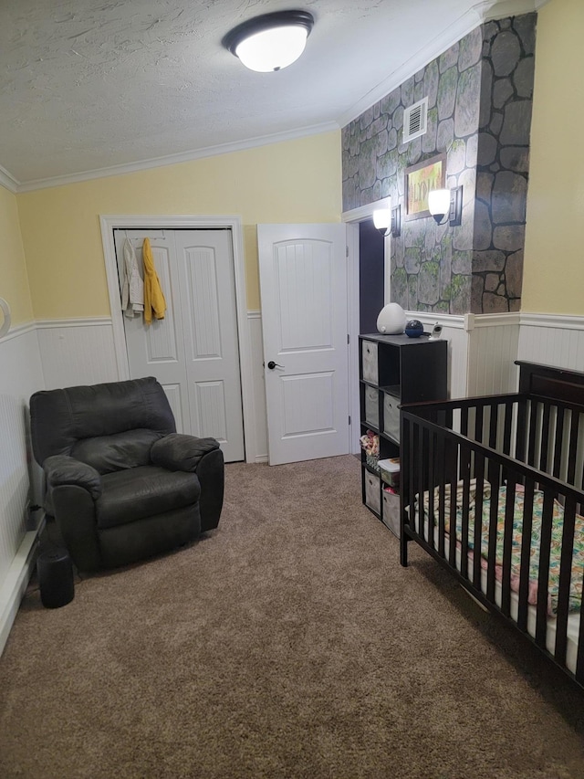 29829 400th Ave, Roseau, MN 56751 - carpeted bedroom with crown molding, a wainscoted wall, a closet, and a crib