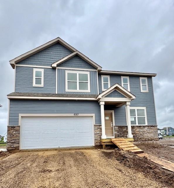6187 Jensen Alcove S, Cottage Grove, MN 55016 - craftsman inspired home with stone siding, an attached garage, and driveway