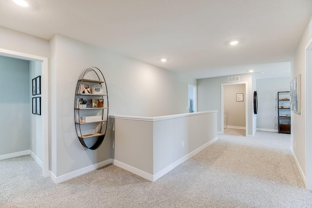 6187 Jensen Alcove S, Cottage Grove, MN 55016 - corridor with light colored carpet, recessed lighting, and an upstairs landing