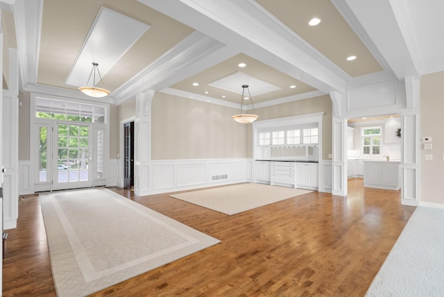 1505 Edgewater Ave, Arden Hills, MN 55112 - unfurnished living room with a decorative wall, crown molding, wood finished floors, a wainscoted wall, and recessed lighting