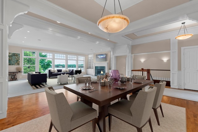 1505 Edgewater Ave, Arden Hills, MN 55112 - dining space with crown molding, light wood-style floors, a lit fireplace, and recessed lighting