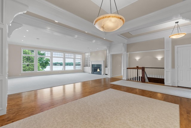 1505 Edgewater Ave, Arden Hills, MN 55112 - unfurnished living room featuring crown molding, plenty of natural light, wood finished floors, a glass covered fireplace, and recessed lighting