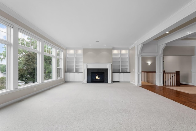 1505 Edgewater Ave, Arden Hills, MN 55112 - unfurnished living room with crown molding, carpet floors, a high end fireplace, built in shelves, and recessed lighting