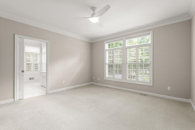 1505 Edgewater Ave, Arden Hills, MN 55112 - spare room with crown molding, a ceiling fan, and light carpet