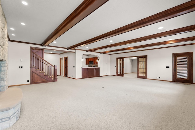 1505 Edgewater Ave, Arden Hills, MN 55112 - unfurnished living room with beamed ceiling, recessed lighting, light colored carpet, stairs, and arched walkways