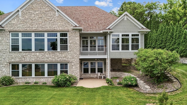 1505 Edgewater Ave, Arden Hills, MN 55112 - back of property with stone siding, a yard, a patio, and roof with shingles