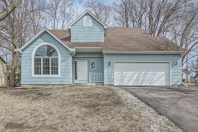 5298 Park Dr, Savage, MN 55378 - ranch-style home with aphalt driveway, an attached garage, and a shingled roof