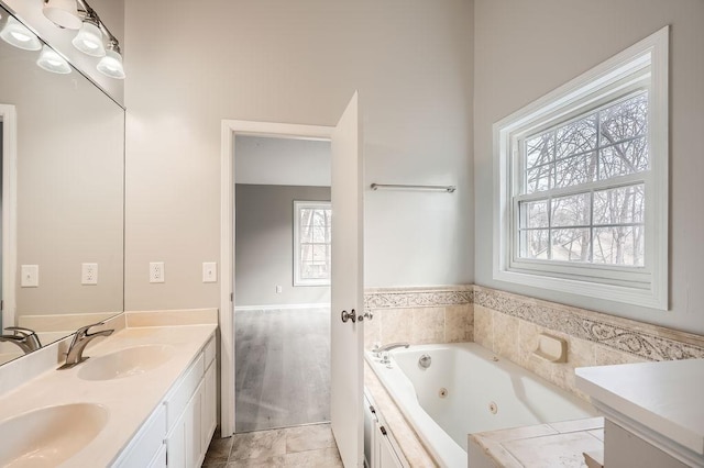 5298 Park Dr, Savage, MN 55378 - full bathroom with double vanity, a jetted tub, and a sink