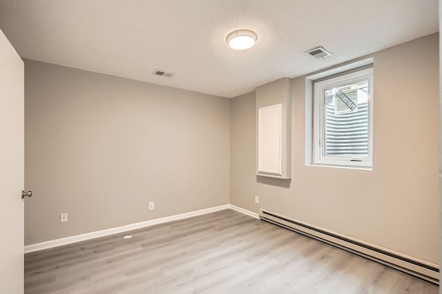5298 Park Dr, Savage, MN 55378 - spare room featuring visible vents, a baseboard heating unit, and baseboards