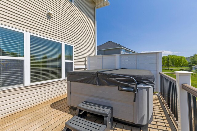 wooden terrace with a hot tub
