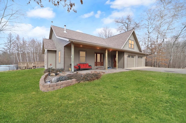 1572 44th St SW, Pine River, MN 56474 - view of front of home featuring roof with shingles, concrete driveway, a front lawn, and an attached garage