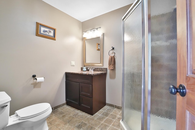 1572 44th St SW, Pine River, MN 56474 - bathroom with baseboards, toilet, a stall shower, and vanity