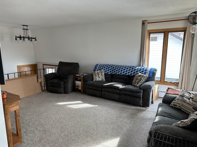 carpeted living area with an inviting chandelier, a textured ceiling, and baseboard heating