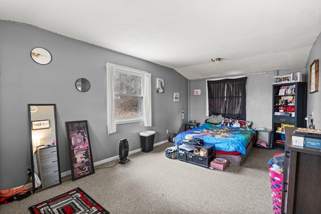 bedroom with lofted ceiling, carpet flooring, and baseboards