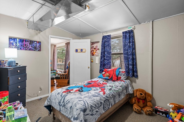 bedroom with lofted ceiling and carpet