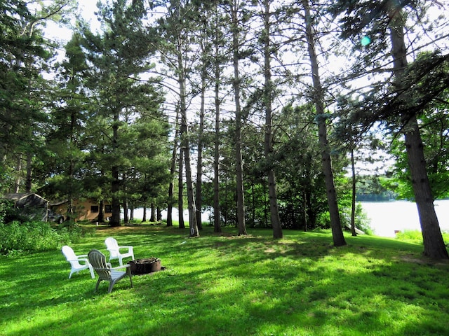 201 27 1/4 26 7/8 Avenue A, Cumberland, WI 54829 - view of grassy yard featuring an outdoor fire pit and a water view