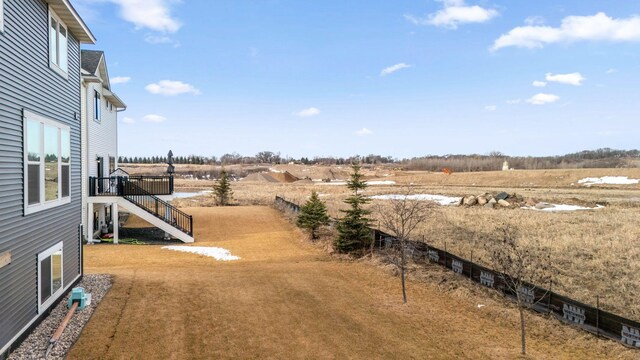 view of yard with a rural view