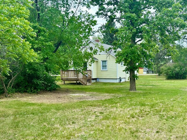 329 Main St NW, Menahga, MN 56464 - view of green lawn featuring a wooden deck
