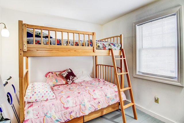 329 Main St NW, Menahga, MN 56464 - bedroom with baseboards and wood finished floors