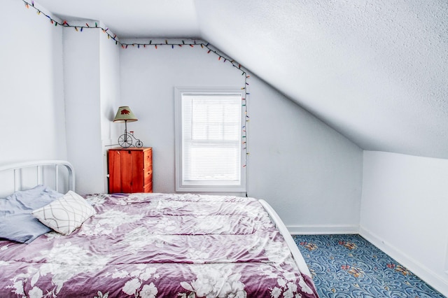 329 Main St NW, Menahga, MN 56464 - carpeted bedroom with lofted ceiling, a textured ceiling, and baseboards