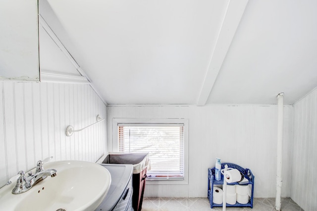 329 Main St NW, Menahga, MN 56464 - bathroom featuring a sink and beamed ceiling