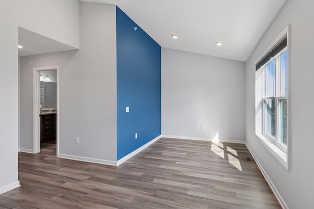 8949 Village Loop, Chanhassen, MN 55317 - unfurnished room featuring wood finished floors, baseboards, and recessed lighting