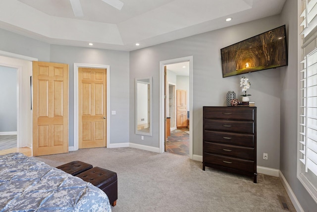 carpeted bedroom with baseboards, recessed lighting, visible vents, and ensuite bathroom