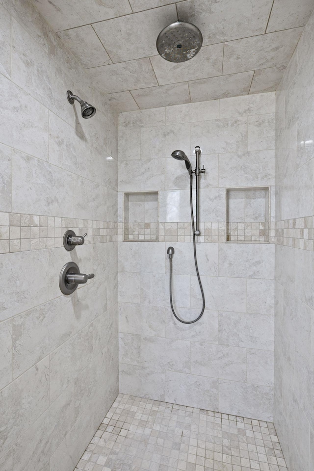 bathroom featuring tiled shower