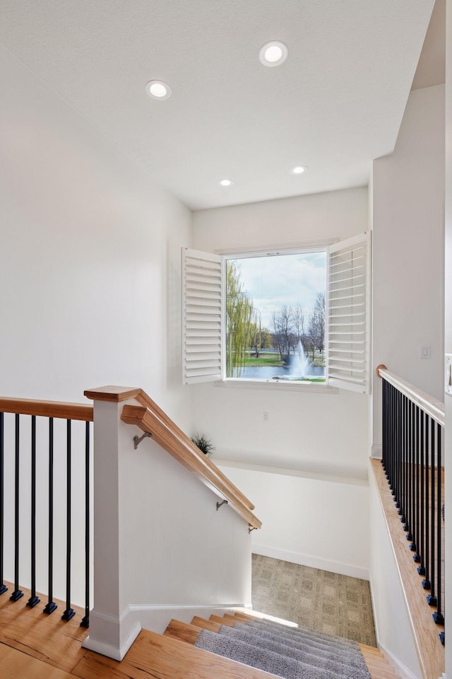 stairs featuring recessed lighting and baseboards