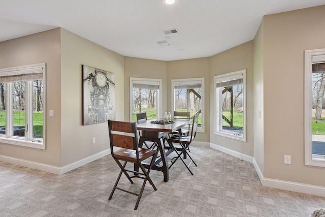dining area with recessed lighting, visible vents, light carpet, and baseboards