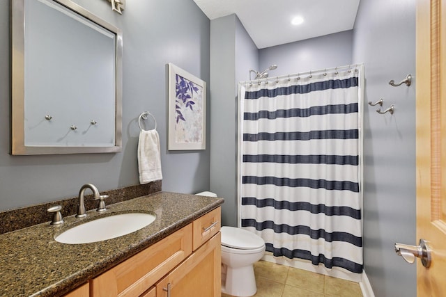 full bath featuring tile patterned floors, curtained shower, toilet, and vanity