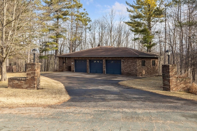 W828 Evergreen Ct, Spring Valley, WI 54767 - view of side of property featuring driveway and a garage