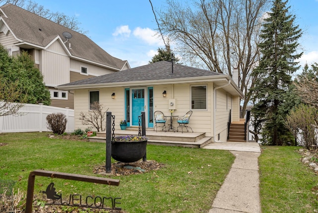 back of house with a lawn, a chimney, fence, and a deck