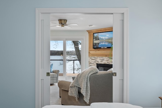 interior space featuring a tile fireplace and access to exterior