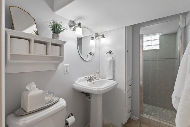 full bath with a stall shower and toilet