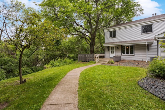 4854 Grenwich Trl N, Oakdale, MN 55128 - view of grassy yard featuring a wooden deck