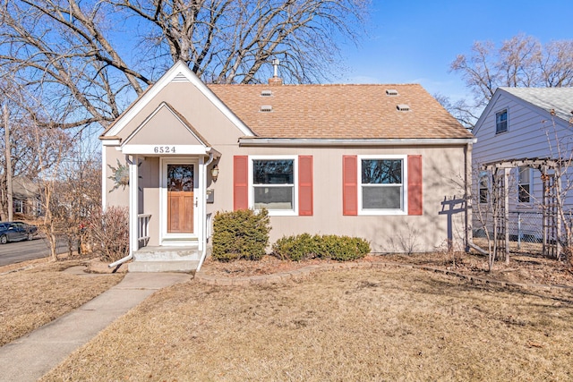 6524 Minnetonka Blvd, Saint Louis Park, MN 55426 - bungalow-style home featuring a shingled roof and a chimney