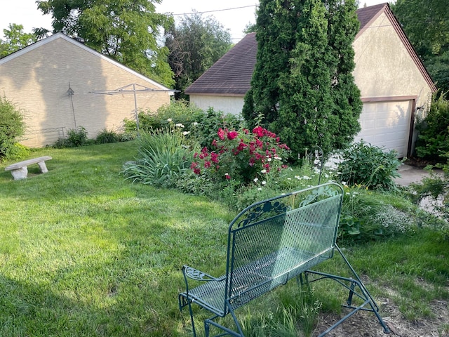 view of yard featuring a garage